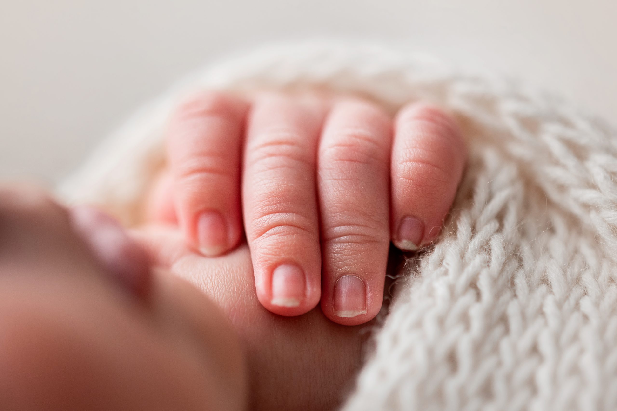 Newborn Photoshoot Wakefield. Close up macro photo of baby's fingers.