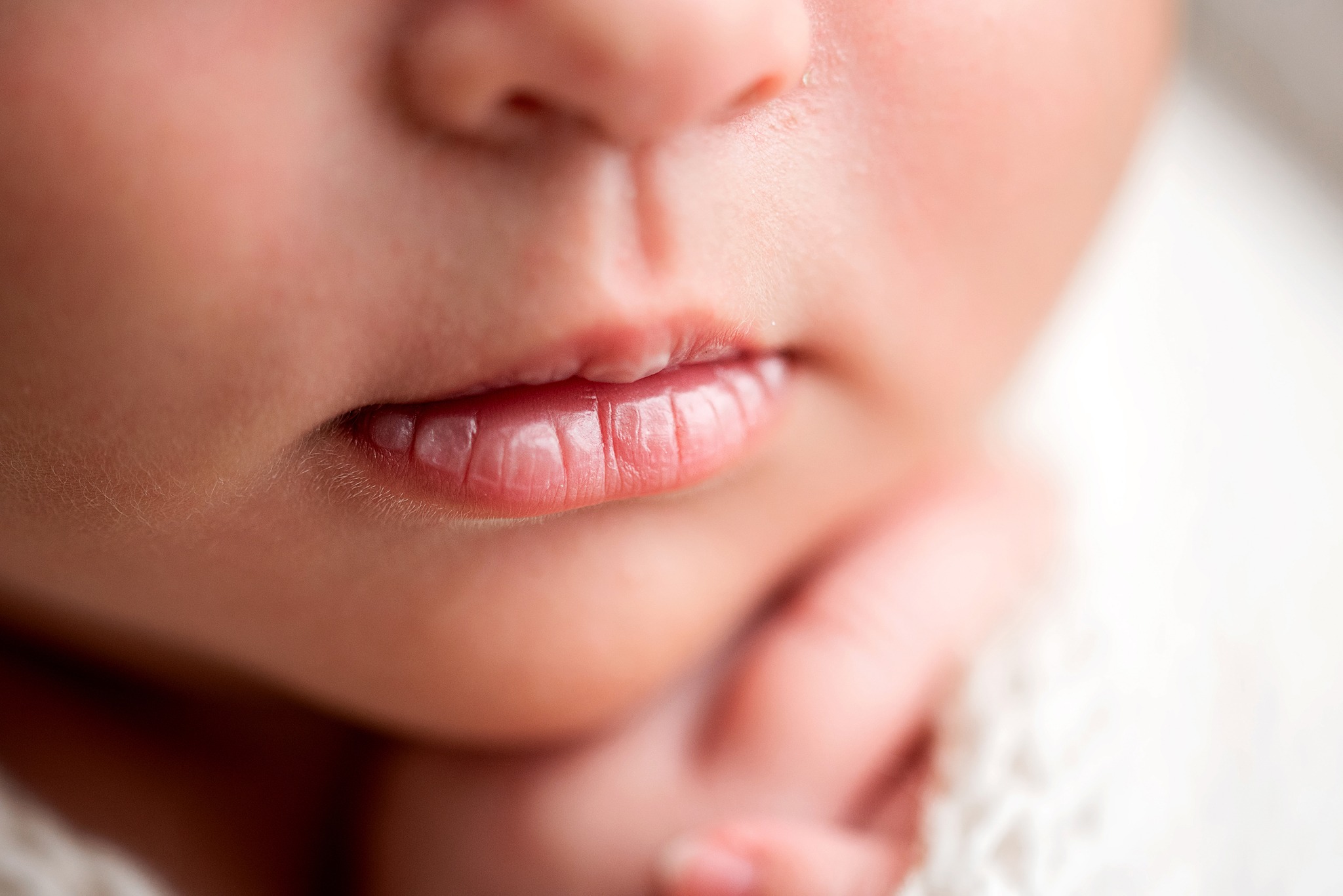 Newborn Photoshoot Wakefield. Close up macro photo of baby's lips.